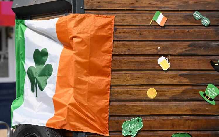 An Irish flag hanging on a cart with St Patrick's Day decorations